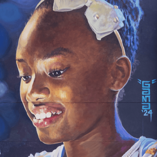 Realistic mural painting of a smiling young girl wearing a white bow headband, created in 2024, with a blue artistic background